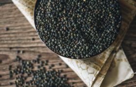 dried blue green lentils in a cast iron pot