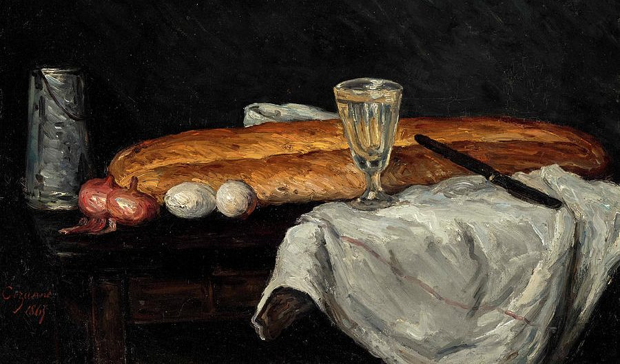 Bread and eggs & a wine glass against a dark background